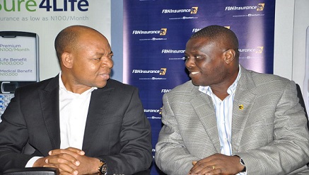 (L-R) Lucas Dada, director, Business Segment, Etisalat Nigeria, with Segun Balogun, general manager, FBN Insurance, during the launch of "Sure 4 Life", an airtime-based FBN Insurance life policy in partnership with Etisalat Nigeria, held at Marina, Lagos last weekend.